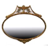 A Regency style gilt gesso wall mirror decorated an urn and swags, 79cm (31 ins) wide