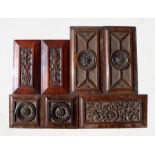A group of late 19th century carved walnut panels. largest 41cm (16 ins) wide (7)