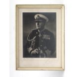 A mid 20th century signed black & white photo of a Naval Officer, framed & glazed, 15.5 by 21cms (