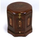 A hardwood lidded box with brass inlay, of octagonal form, 43cms (17ins) wide.