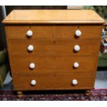 A Victorian pine chest of two short and three long drawers, 97cms (38ins) wide.