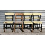 A set of four painted beech child's chairs with solid seats.