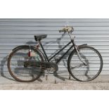 A Hercules Cycle & Motorcycle ladies bicycle with chrome front forks, rod brakes, enclosed chain and