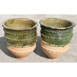 A pair of large half glazed Turkish pottery planters, 62cms (24.5ins) high (2).