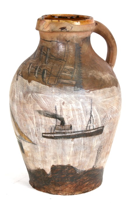 Follower of Alfred Wallis, an earthenware pottery jug decorated with ships, 38cms (15ins) high.