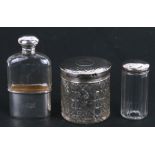 A silver & cut glass hip flask, London 1898, and two silver topped dressing table jars (3)