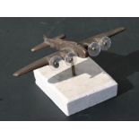 A bronze model of the WW2 heavy bomber the Boeing B-17 Flying Fortress mounted on a marble base.