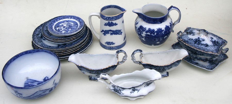 A Doulton Burslem Willow pattern jug; together with a group of Chatsworth blue & white dinner