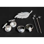 A quantity of assorted silver jewellery to include two silver rings, a cat pendant and silver
