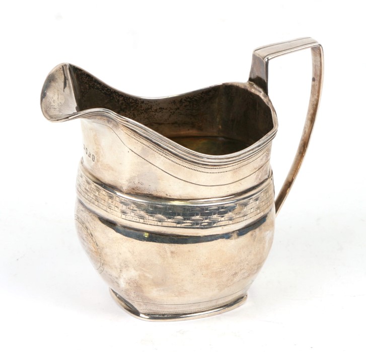 A George III silver cream jug of helmet form, London 1805, weight 128g, 10cms (4ins) high.