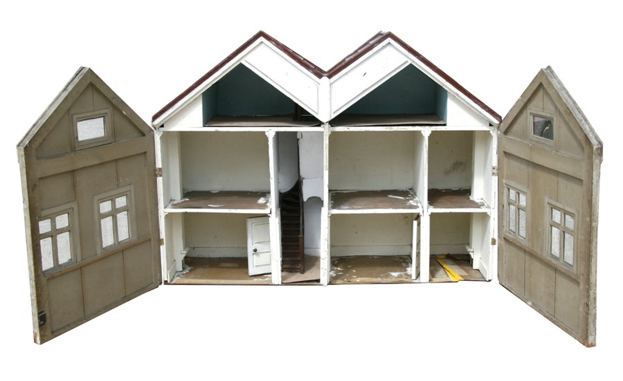 A large 1930's two storey wooden doll's house, 137cms (54ins) wide.