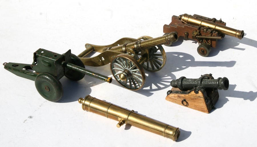 A matchstick firing tinplate cannon overall length 23cms (9ins), together with a brass Signal Cannon