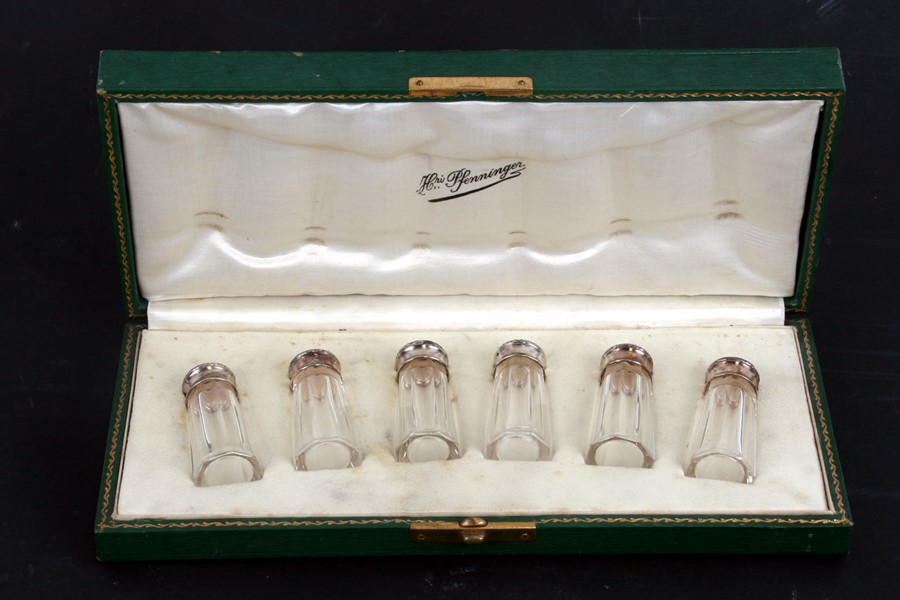 A set of six Henri Pfenninger French silver topped brass pepperettes, cased.