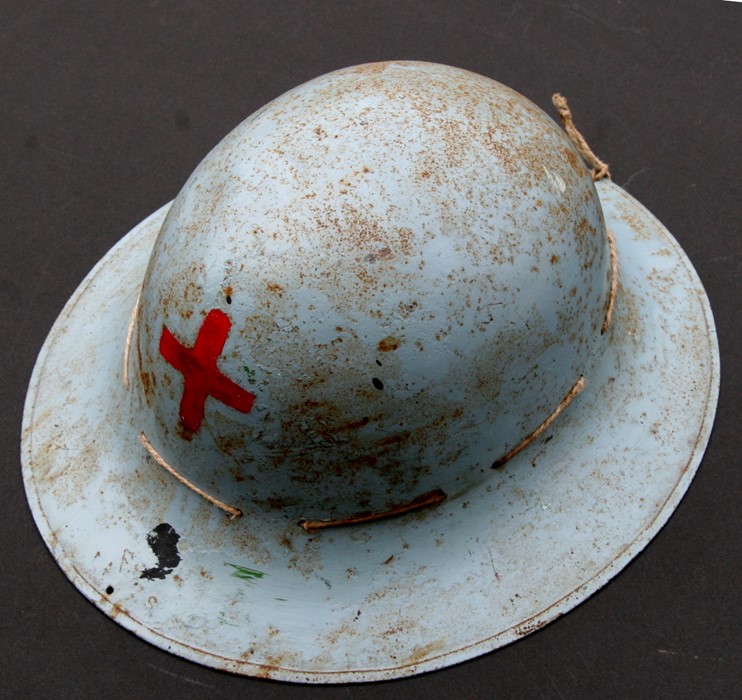 A Zuckerman British WWII Red Cross Civil Defence helmet.