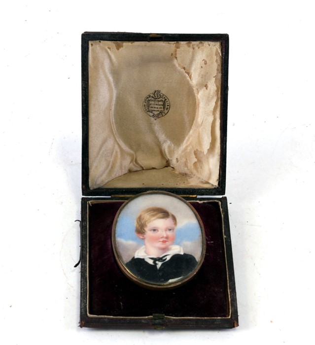 A portrait miniature depicting a young boy, mounted as a brooch in its original shaped and fitted - Image 2 of 2