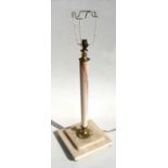 A figured marble table lamp on a stepped square base, 54cms (21.25ins) high.