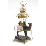 A late 19th century gilt metal and spelter liquor stand modelled as a camel with gilt metal saddle