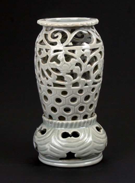 A Japanese celadon glaze pierced lantern, 23cms (9ins) high.