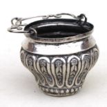 An Italian embossed silver Holy Water bucket with swing handle, overall 13cms (5ins) high.