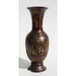 A Chinese Export lacquered wooden vase decorated figures in a landscape on a deep red ground with