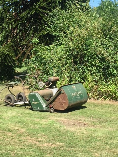 A Dennis grounds keeper ride on lawnmower.