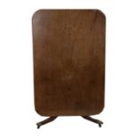 A 19th century mahogany rectangular tilt top breakfast table on turned column and tripod base,