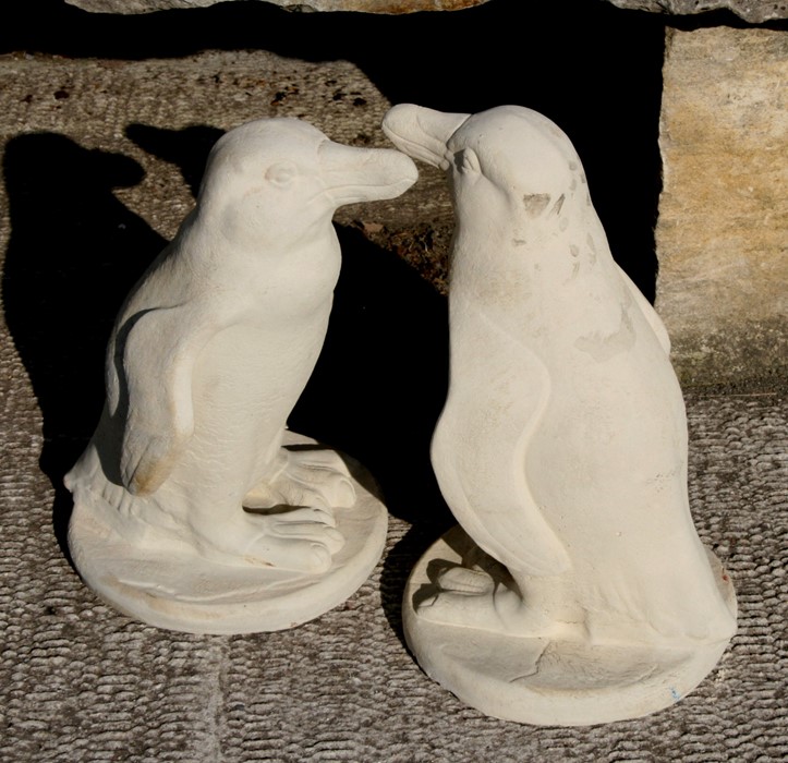 A pair of reconstituted stone penguins, each 50cms (20ins) high (2).