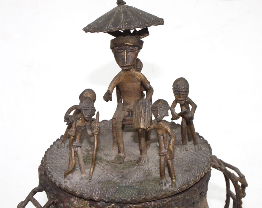 An African tribal bronze urn and cover surmounted with figures, 27cms 910.5ins) high. - Image 2 of 3