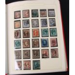 A collection of United States of America stamps from 1850 - 2000, housed in a Stanley Gibbons