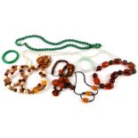 An amber type bead necklace and other necklaces and beads.