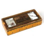 An 18th century pencil box with painted decoration on a yellow ground, the mirrored top with central