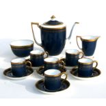 A Minton coffee set with gilt decoration on a blue ground.Condition Reportone coffee can has
