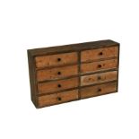 A pine bank of eight drawers, 94cms (36.5ins) wide. 56cm ( 22 ins) high 22cm (8.75 ins)