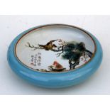 A Chinese Republic style shallow bowl decorated with birds and calligraphy, on a turquoise ground,