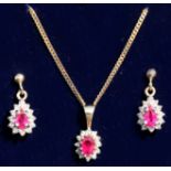 A suite of 9ct gold, ruby and diamond jewellery comprising earrings and matching pendant on chain,