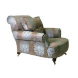 A Howard style silk upholstered armchair.Condition ReportThere is slight play in both arms and there