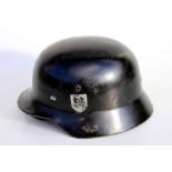 A WW2 M35 Third Reich helmet with liner and chin strap. Marked inside the helmet N.S.66 and D. 12.