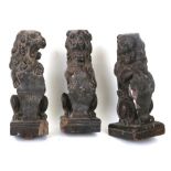 Three late 18th century carved oak rampant lions holding shields, each approx 23cms (9ins) high (