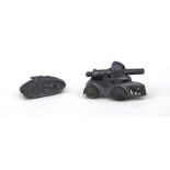 A grey metal matchstick firing WW1 Tank on 4 wheels 54mm (2.125ins) long together with another