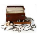 A leather doctors case containing an assortment of medical instruments
