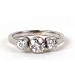 An unmarked white gold three stone diamond ring. Approx UK size L. Condition Reportcentral stone