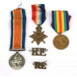 A WW1 Royal Engineers medal trio with associated badges named to 3051 Sapper J. Reid. R.E.