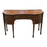A Regency style mahogany sideboard with central frieze drawer flanked by four short drawers, on