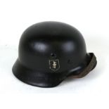 A WW2 Third Reich Nazi M1940 double decal helmet with liner and chin strap. Marked on inside ET 64