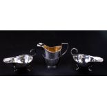 A Victorian silver helmet shaped milk jug with reeded decoration, London 1899, weight 86.8g;