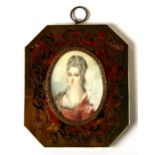 A 19th century portrait miniature depicting a lady with flowers in her hair, 6 by 8.5cms (2.5 by 3.