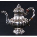A continental 800 grade silver coffee pot with fruit finial and lion head spout. 20cm (8 ins)