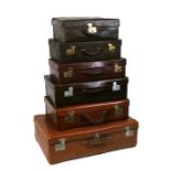 Six vintage suitcases, the largest 76cms (36ins) wide (6).