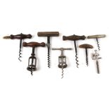 A group of corkscrews; together with a champagne tap.