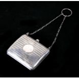 A silver purse on chain with finger ring. 71gCondition ReportBirmingham hallmark but date letter